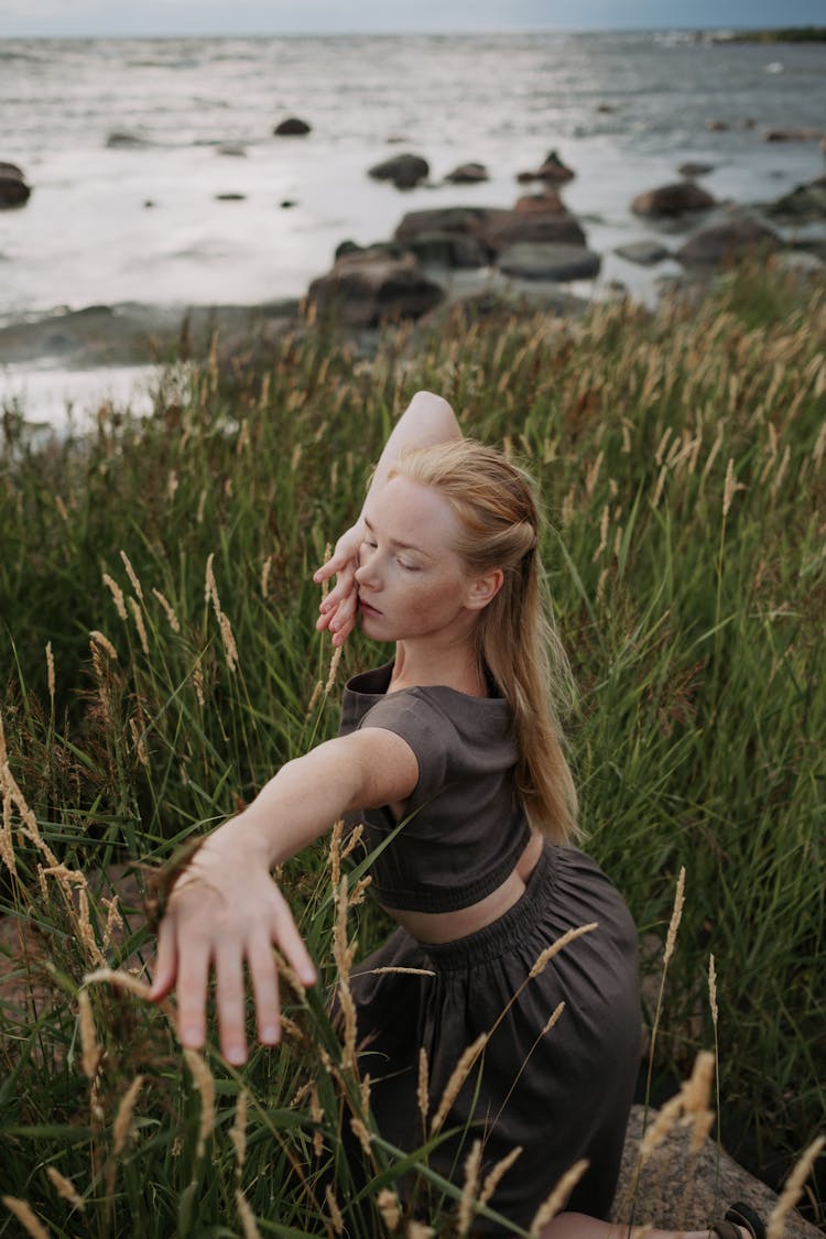 A High Angle Shot Of A Woman Dancing On The Field