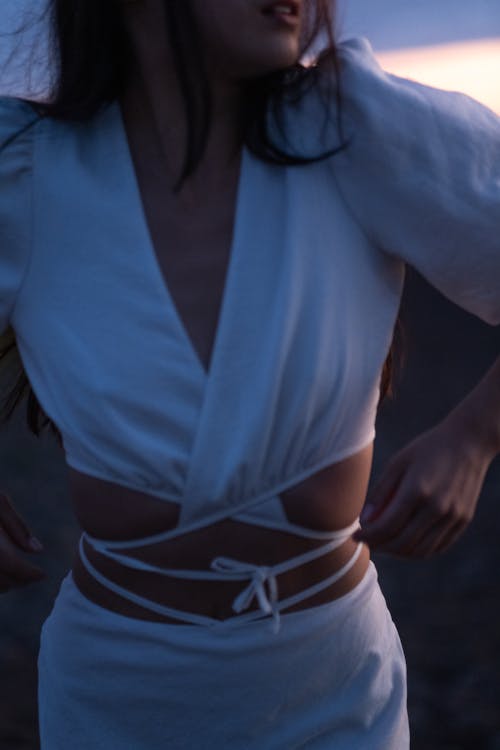 Close-up of a Person in a Stylish White Outfit