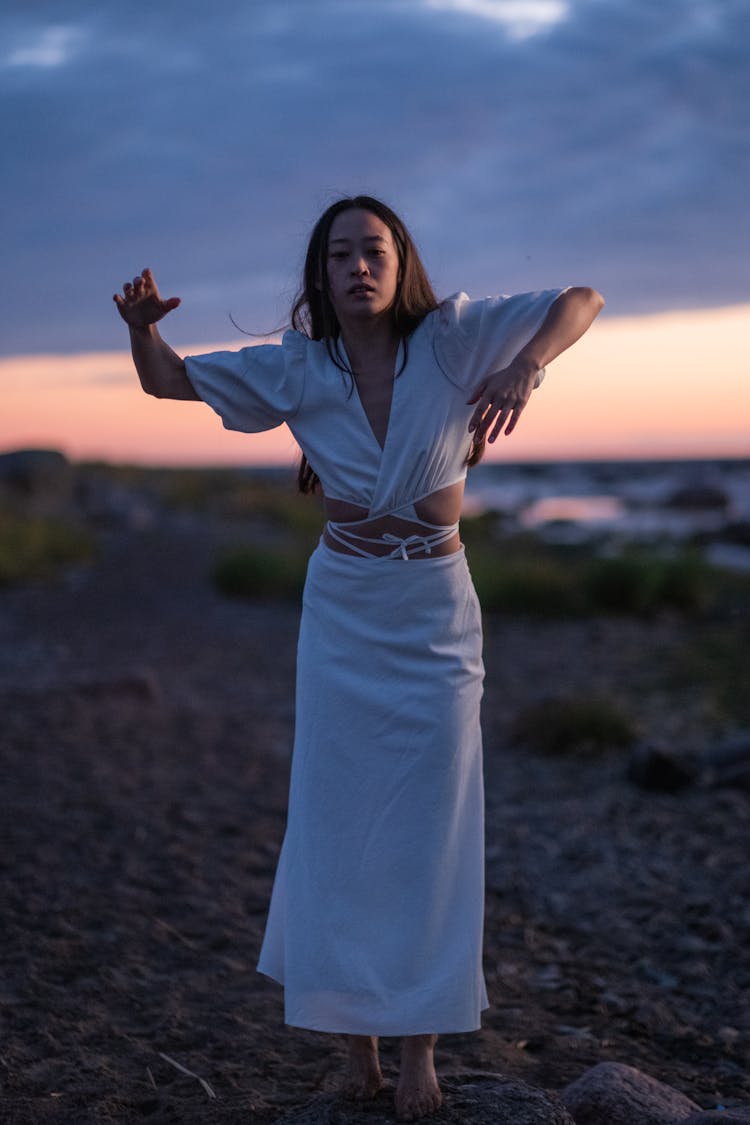 Woman In White Dress Dancing