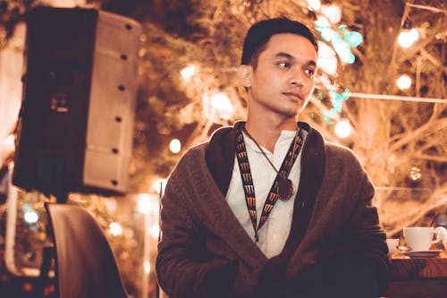 Man Wearing Black Jacket Standing Near Tree