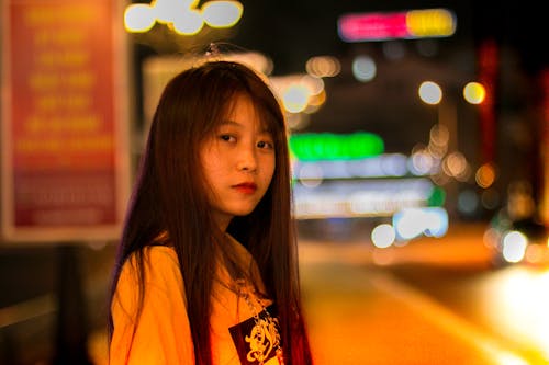 Selective Focus Photo of Woman Wearing Yellow Shirt