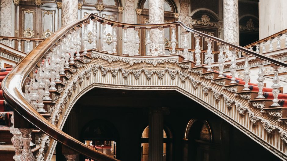 Ornate staircase with intricate design in the historic Dolmabahçe Palace, Istanbul.