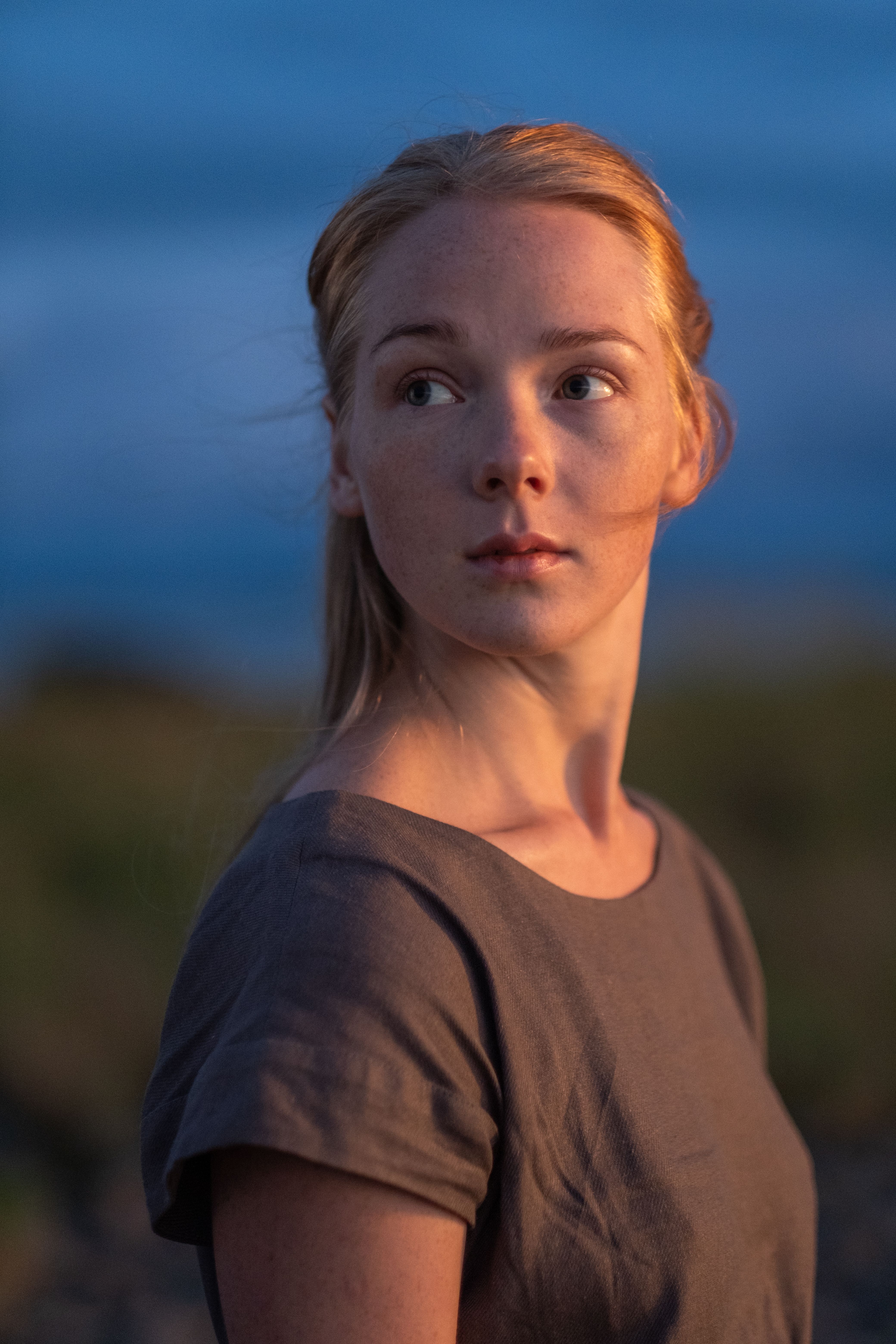 A serene portrait capturing a young woman at golden hour, reflecting tranquility and beauty.