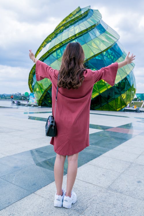 Free Woman Standing In-front of Glass Building Stock Photo