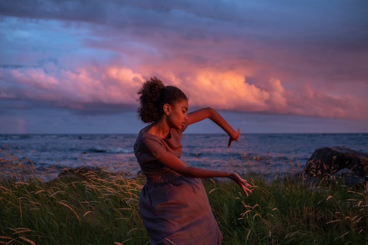 A Dancing Woman On The Grass