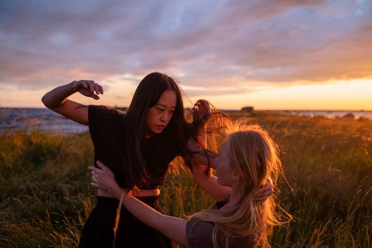 Women Fighting In A Field