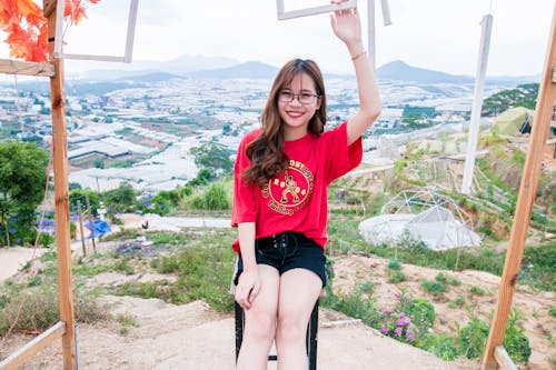 Woman Wearing Red Shirt and Black Shorts