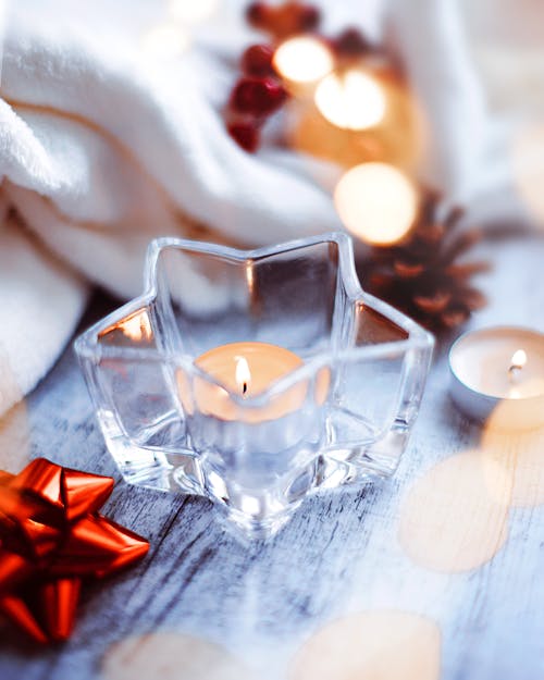 Clear Glass Candle Holder With Lighted Candle
