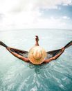 Person Lying Down on Hammock in Water