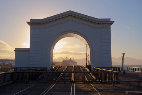 Free Stunning sunset through the iconic Pier 43 Ferry Arch in San Francisco, California. Stock Photo