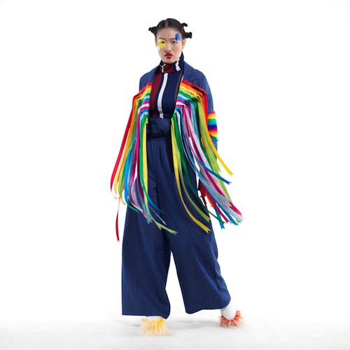Free A Woman Wearing Clothes with Colorful Laces Seriously Looking at Camera Stock Photo