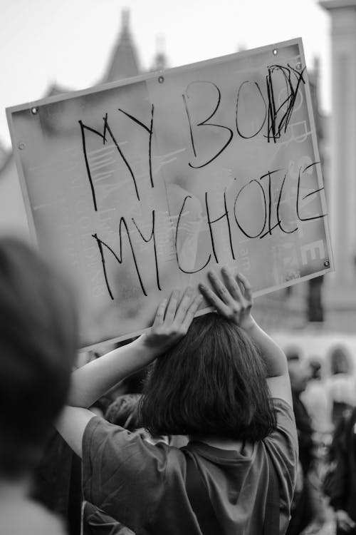 Free Woman Protesting for Women's Rights  Stock Photo