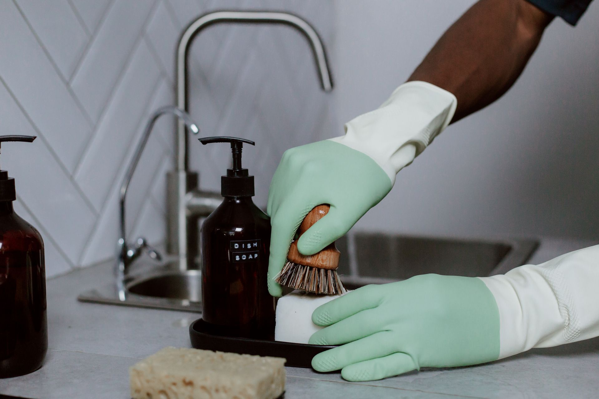 Close Up of Male Hands in Latex Gloves for Washing Dishes