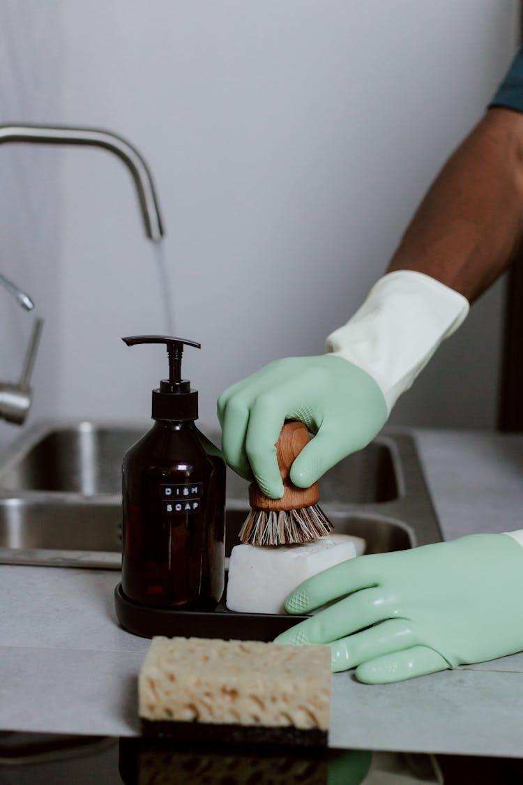 Cleaning Kitchen In Latex Gloves 