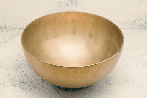 Tibetan Singing Bowl on a White Surface