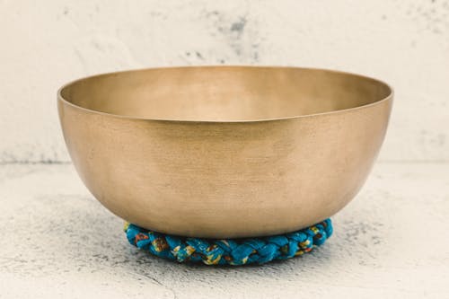 Tibetan Singing Bowl on a White Surface