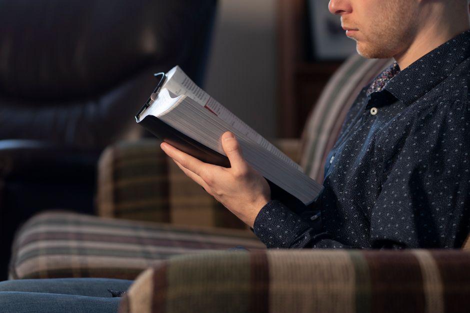person resting and reading Scripture person resting and reading Scripture