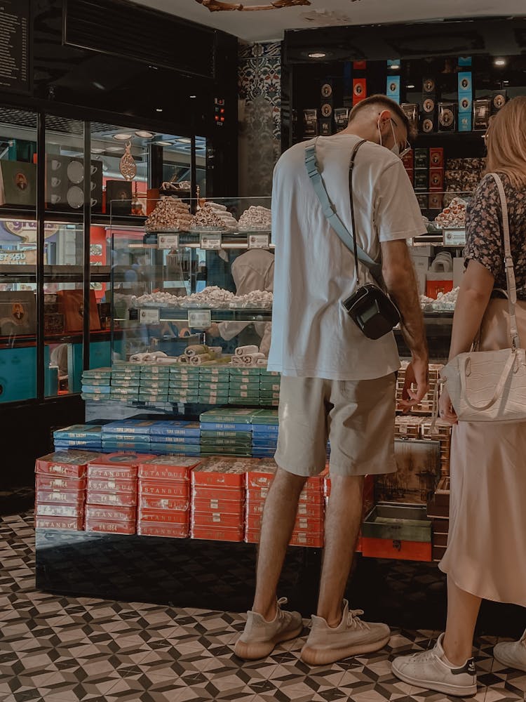 Man And Woman In Store With Turkish Sweets