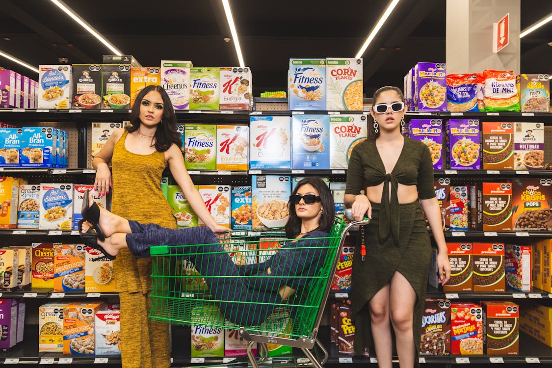 Women Standing beside Display Shelves