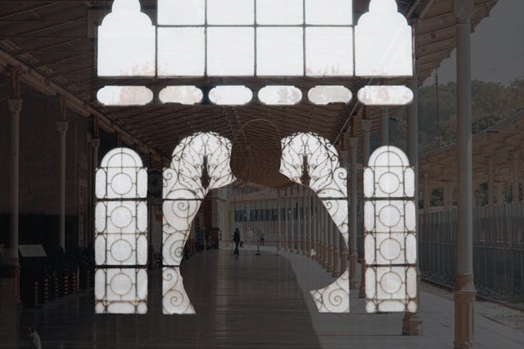 Double Exposure Of A Person And A Building Facade 