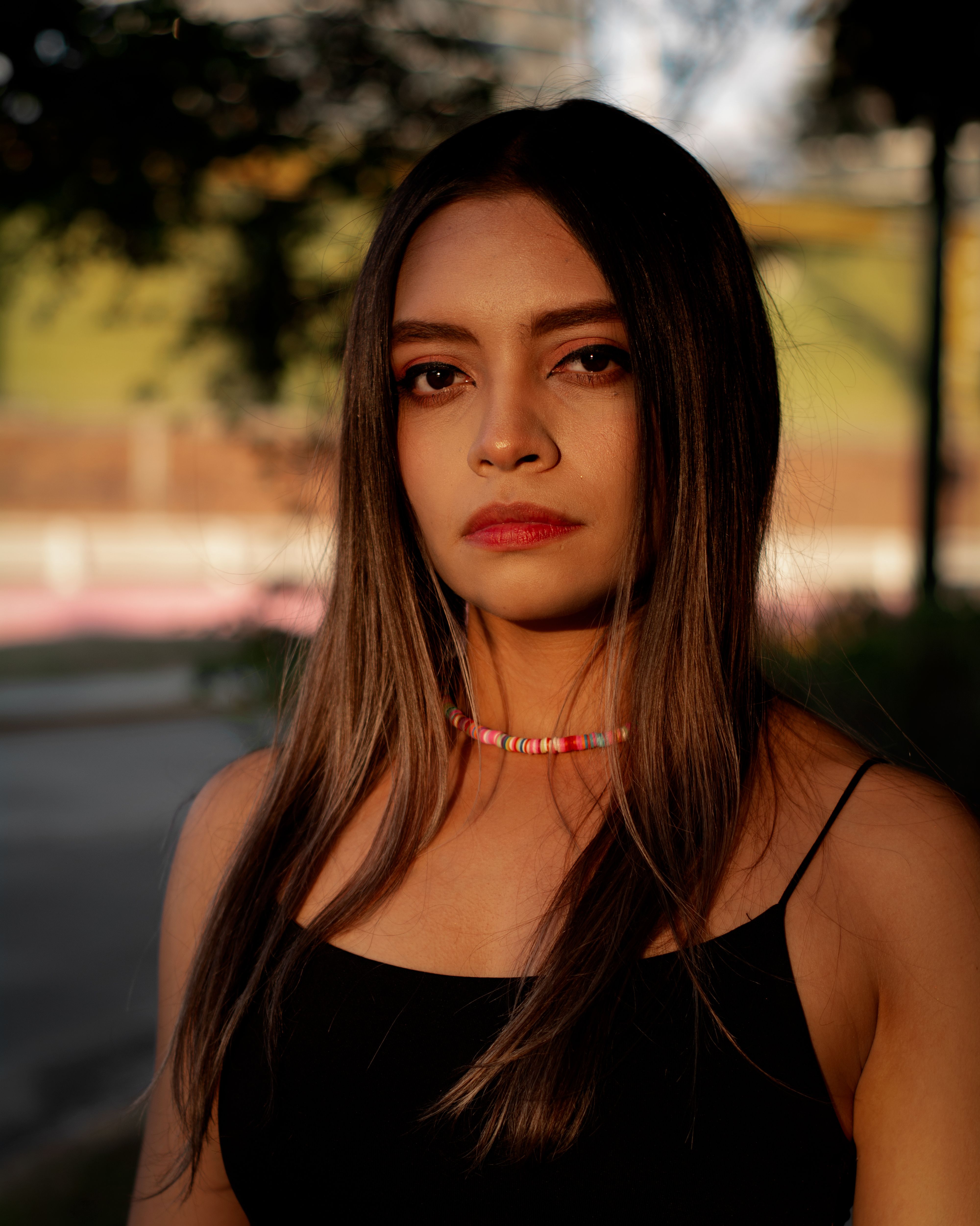 A young woman with a serene expression standing outdoors in Guadalajara, Mexico.