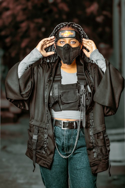A Woman in Black Leather Jacket Wearing Black Mask