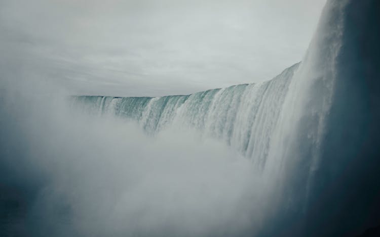 Strong Pressure Of Water Flowing On A Waterfalls