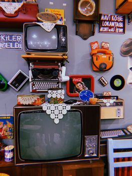 A nostalgic collection of vintage electronics and decor items on display in a cozy setting.
