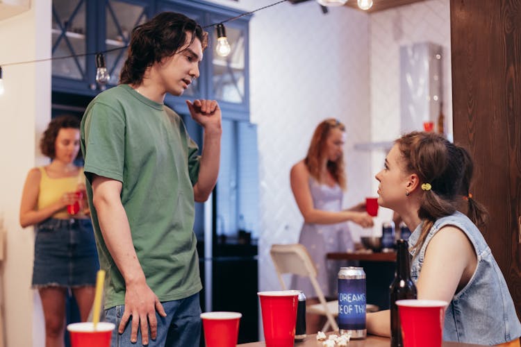 A Man And Woman Talking To Each Other