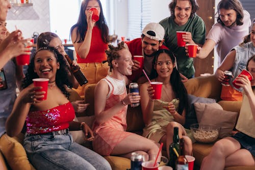 Free People Drinking at a Party Stock Photo