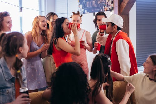 Free Friends in a Drinking Contest Stock Photo