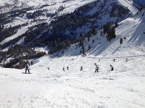 Skiers and snowboarders enjoying winter activities in Selva di Val Gardena, Italy.