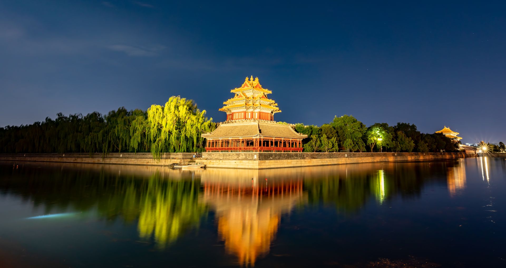 Beijing skyline with historic landmarks lit at dusk