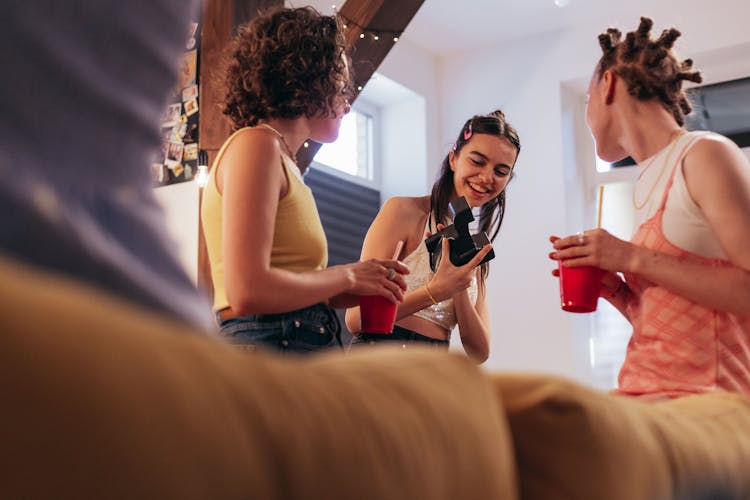 Group Of Young Women Drinking Together