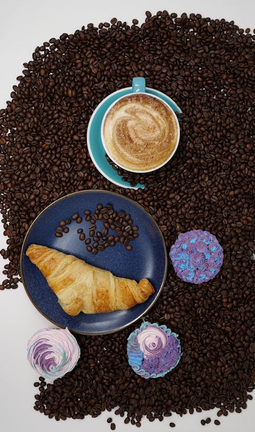 Free A Croissant and a Cup of Coffee Stock Photo