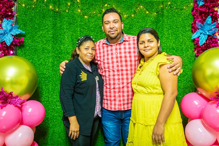 Family Posing For A Photo At A Party 