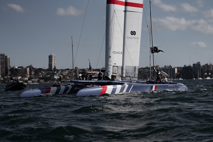 Sailors In An F50 Foiling Catamaran