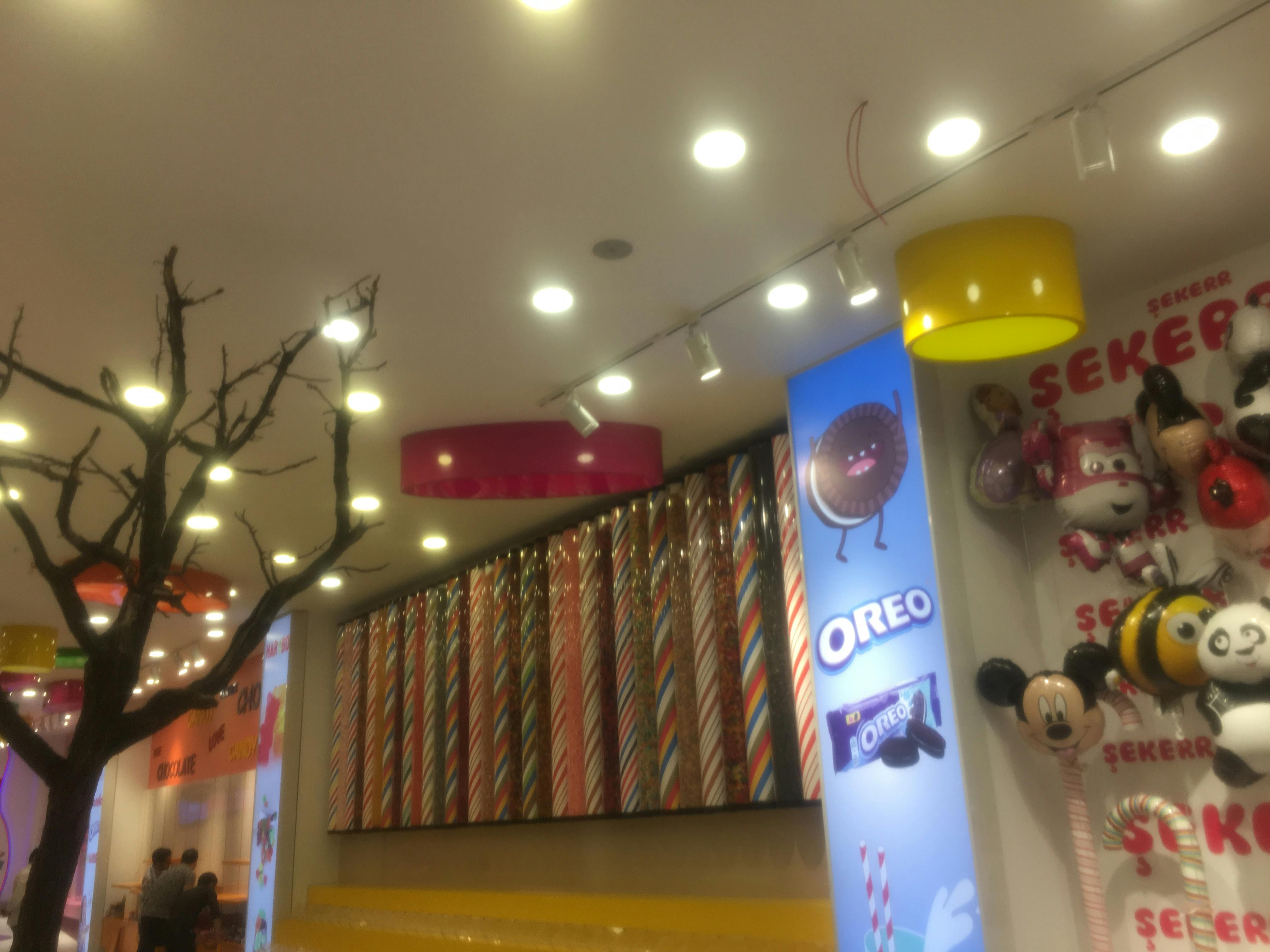 mickey mouse balloon beside oreo poster