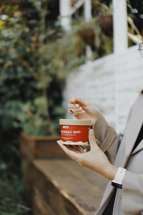 Free A Person Holding an Ice Cream Cup Stock Photo
