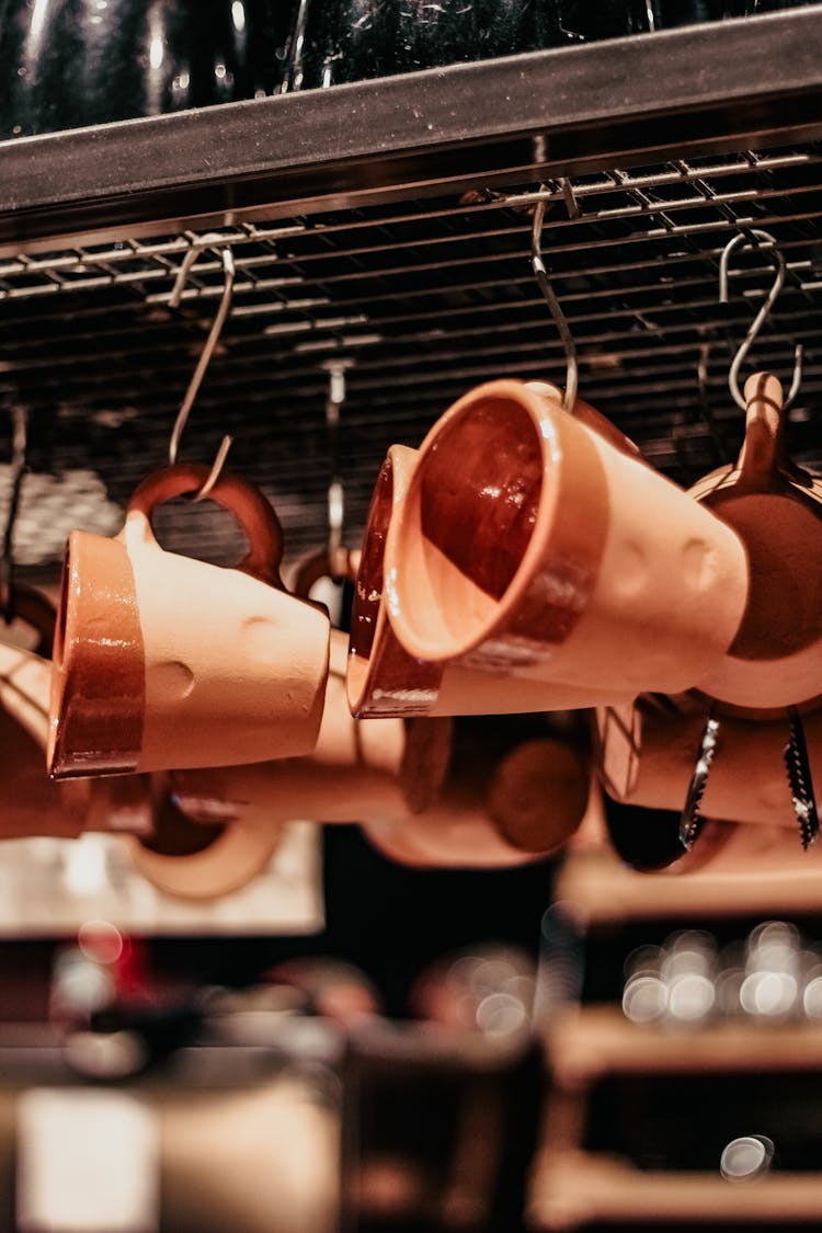 Coffee Cups Hanging On Hooks