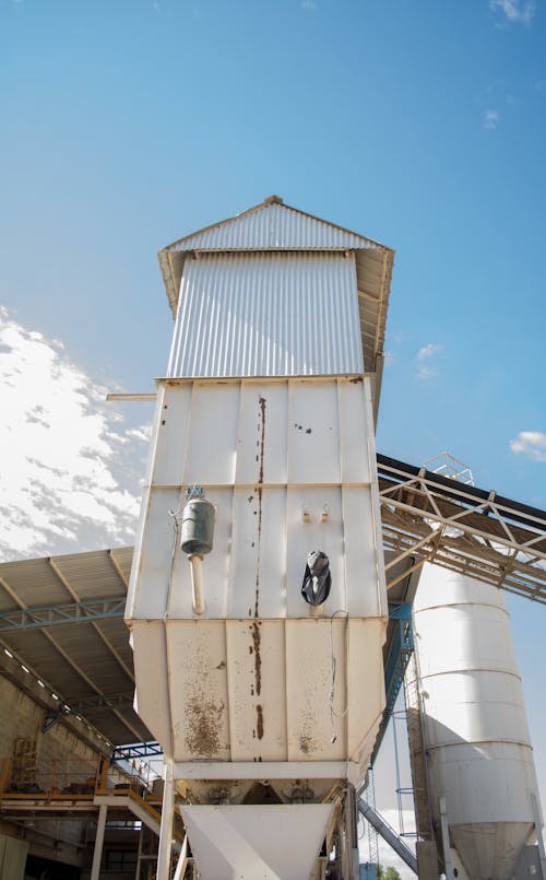 White G.i Sheet Tower Under Blue Sky