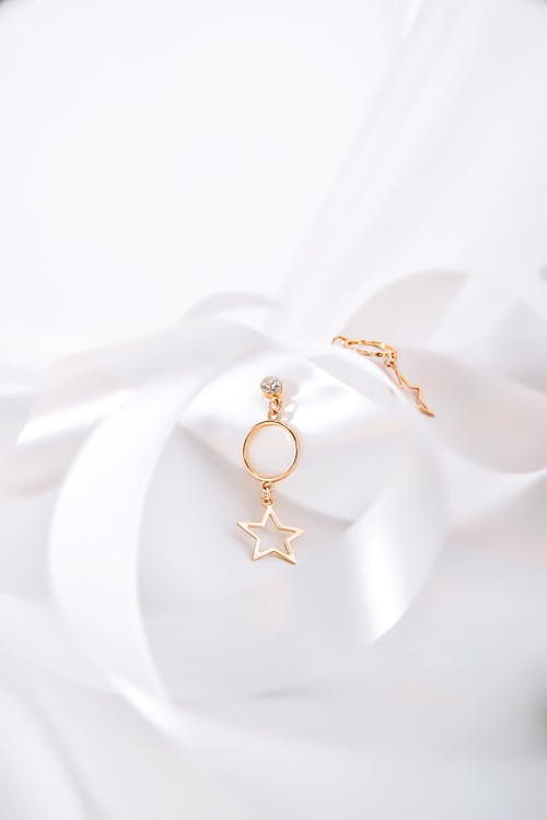 Free Golden Earrings on White Background  Stock Photo