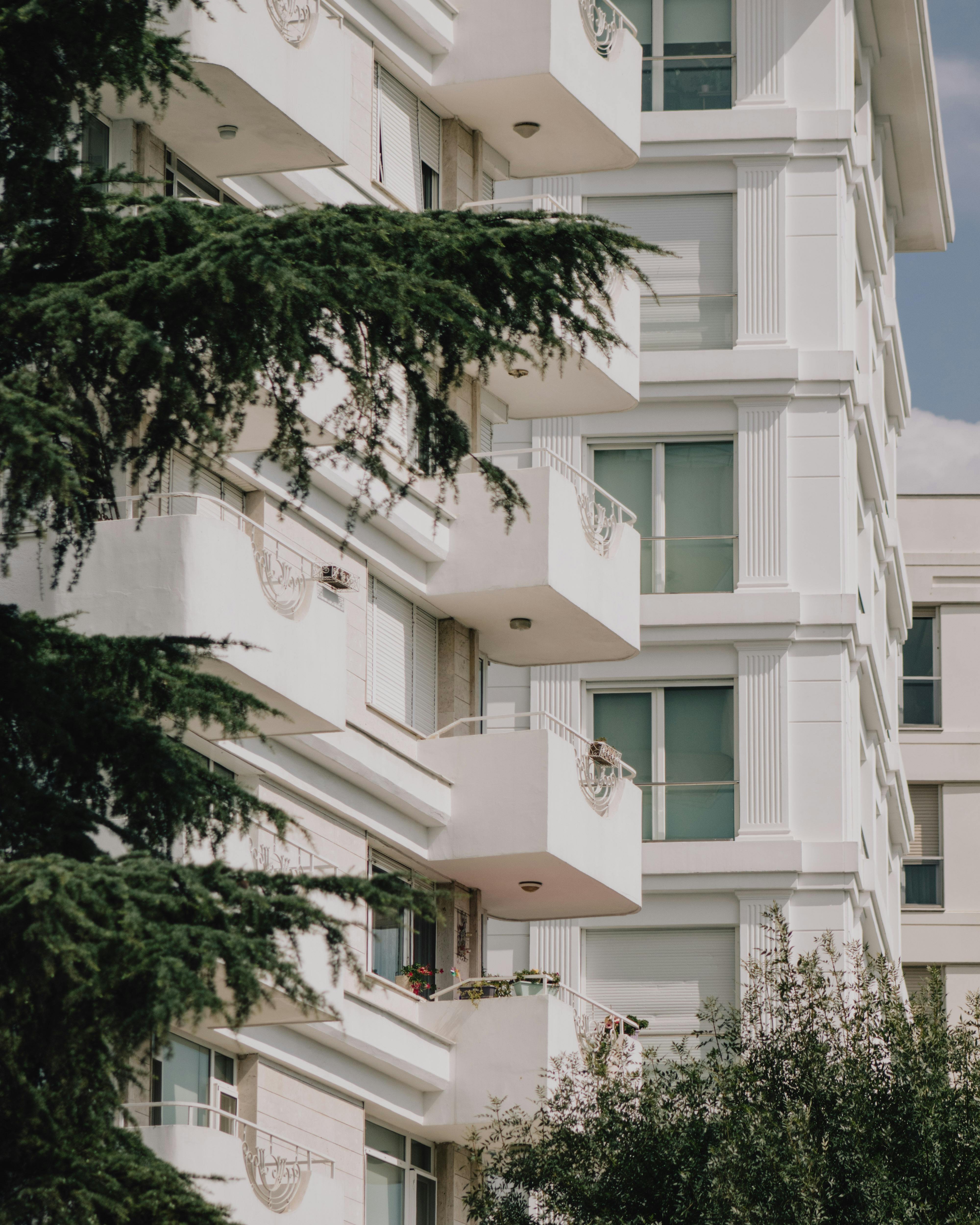 a balcony of white apartment building