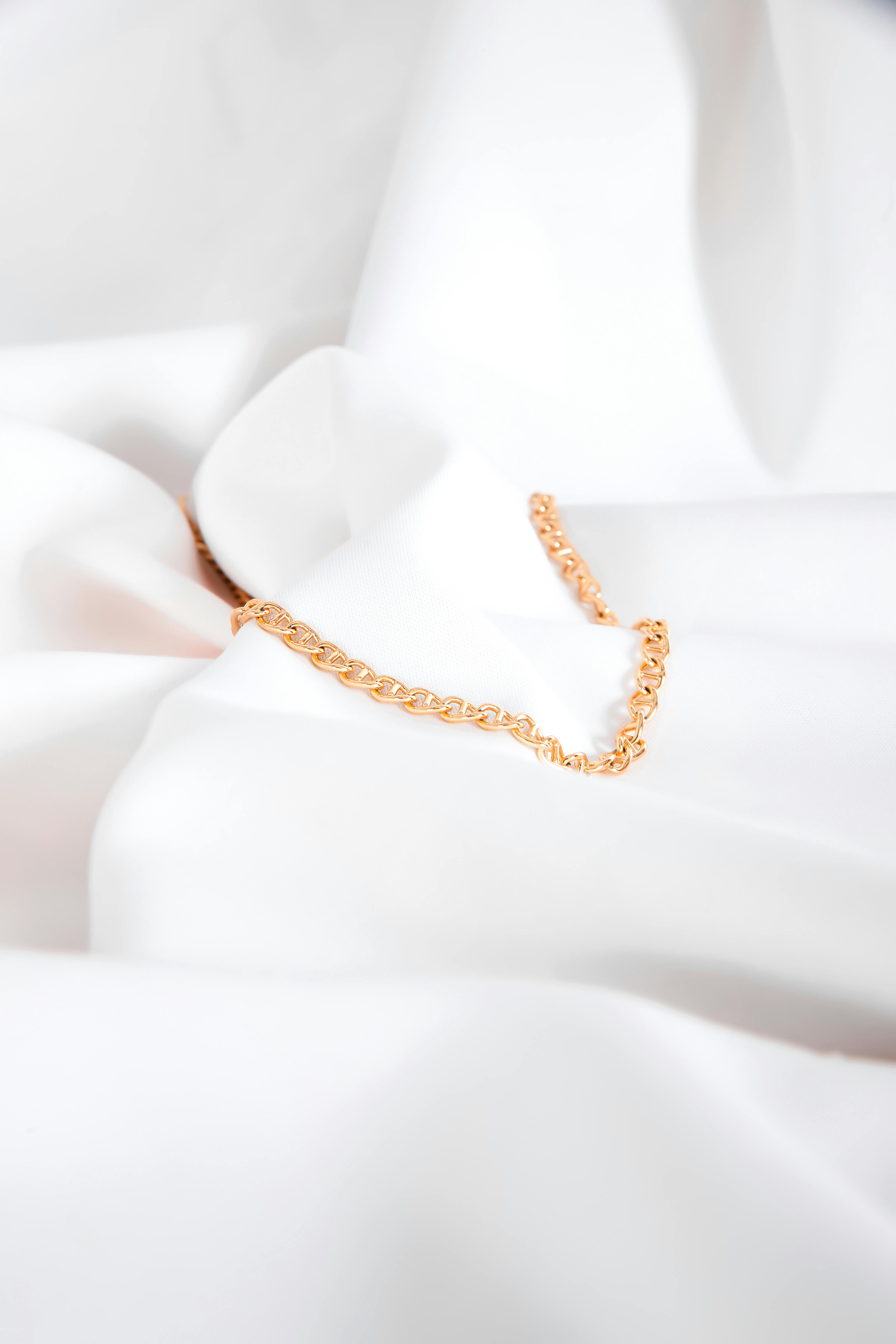 golden necklace on white background