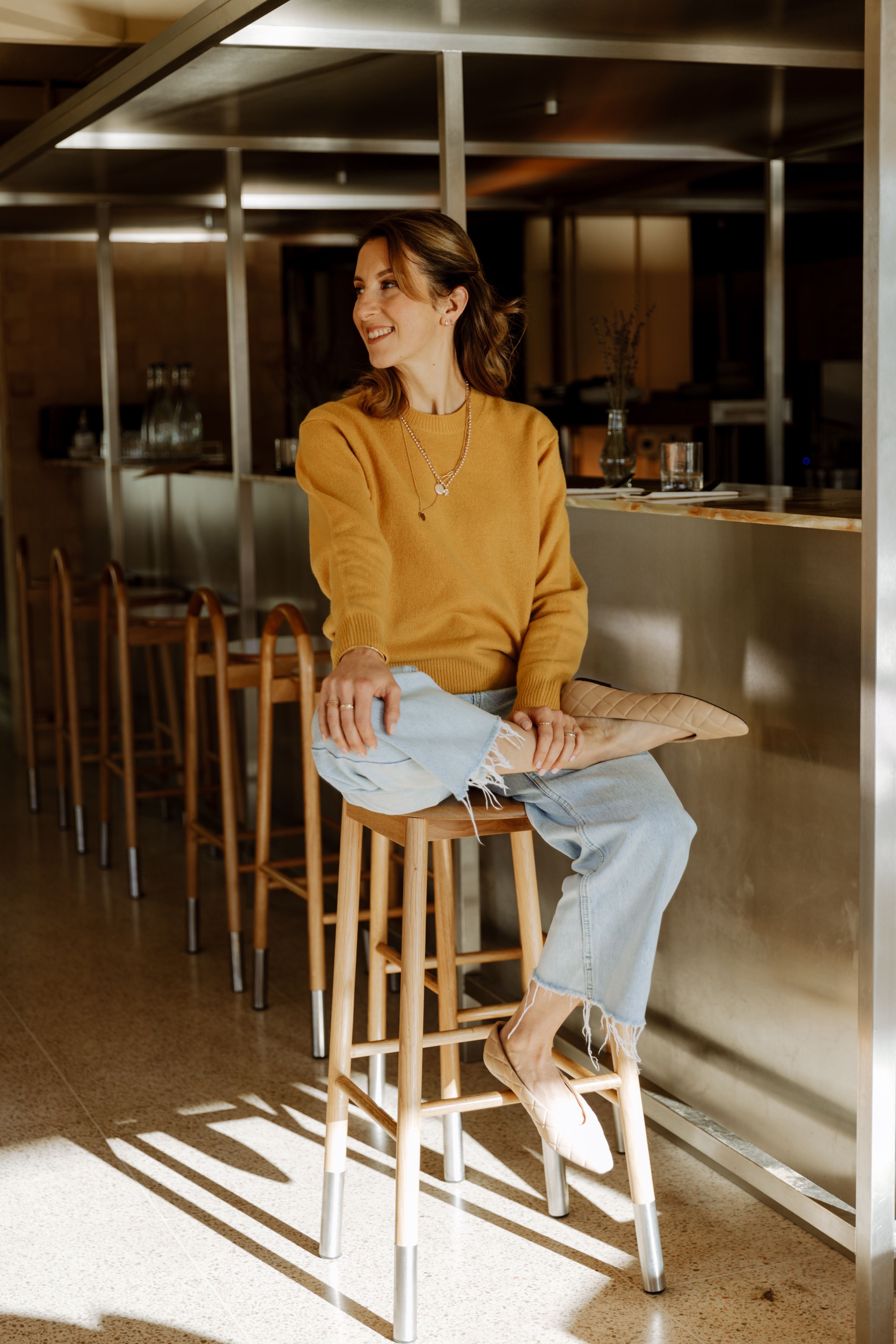 woman sitting on a stool