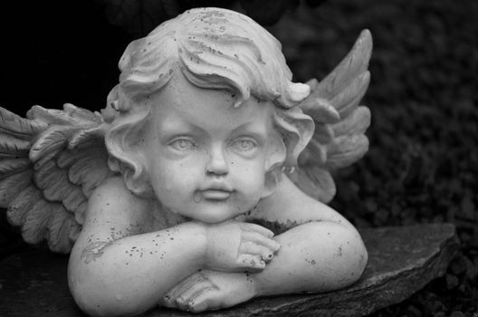 A detailed black and white close-up of an angel sculpture in Bocholt, Germany.