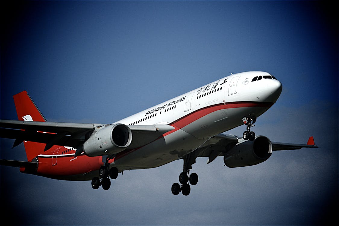 Free White and Red Plane Stock Photo