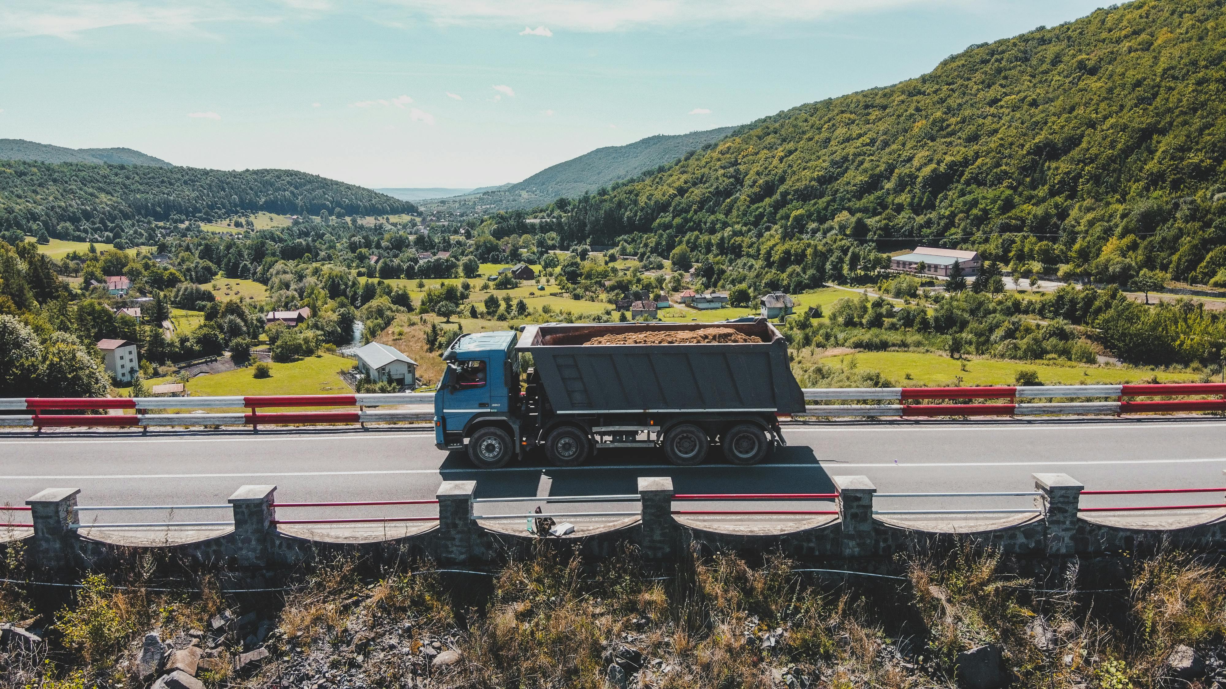 blue and white truck on road