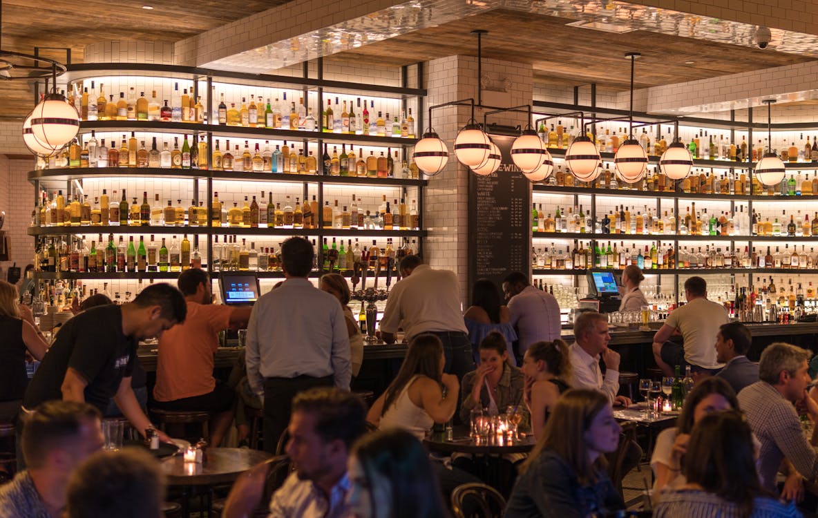 Free Group of People Gathering Inside Bar Stock Photo