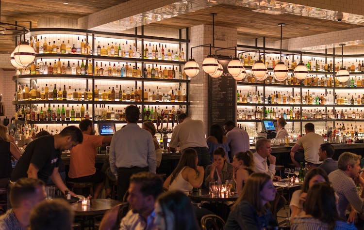 Group Of People Gathering Inside Bar